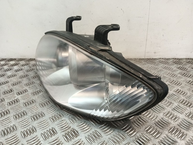 Recambio de faro izquierdo para ssangyong rodius i 2.7 xdi referencia OEM IAM 8310121305  